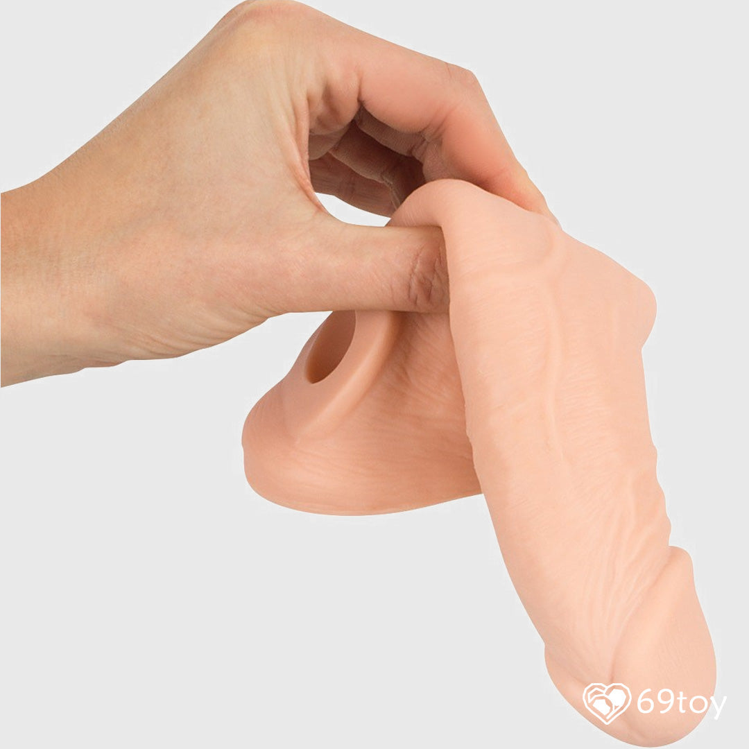 A women holding silicone realistic penis sleeve at 69toy